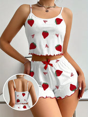 White crop top and shorts set with red strawberry pattern on a plain background