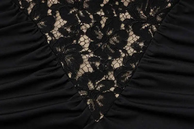 Close-up of black lace fabric with a ruched texture