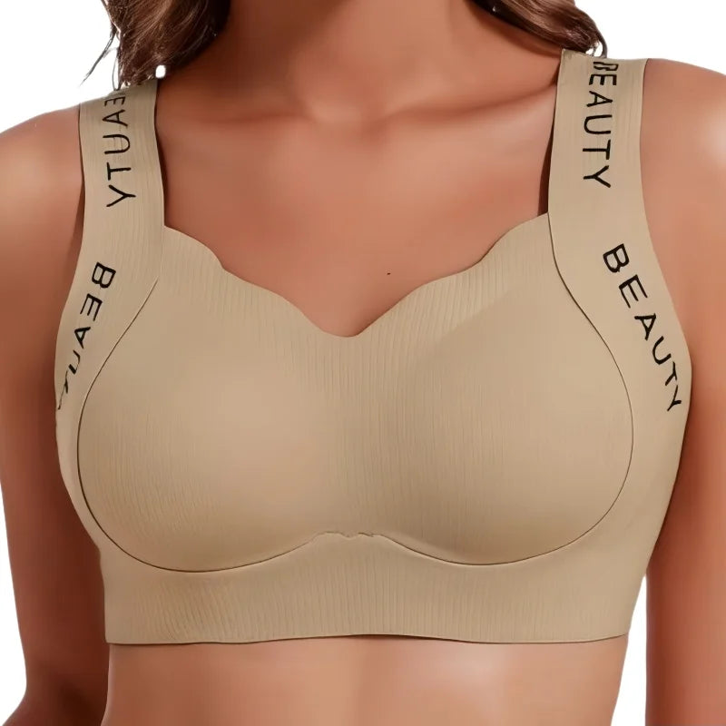 Beige bra with 'BEAUTY' branding on straps against a neutral background