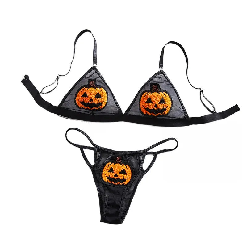 Black Halloween-themed bikini set with jack-o'-lantern designs on a white background