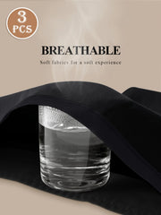 Black fabric draped over a glass of water with text about breathable soft fabrics on a beige background.