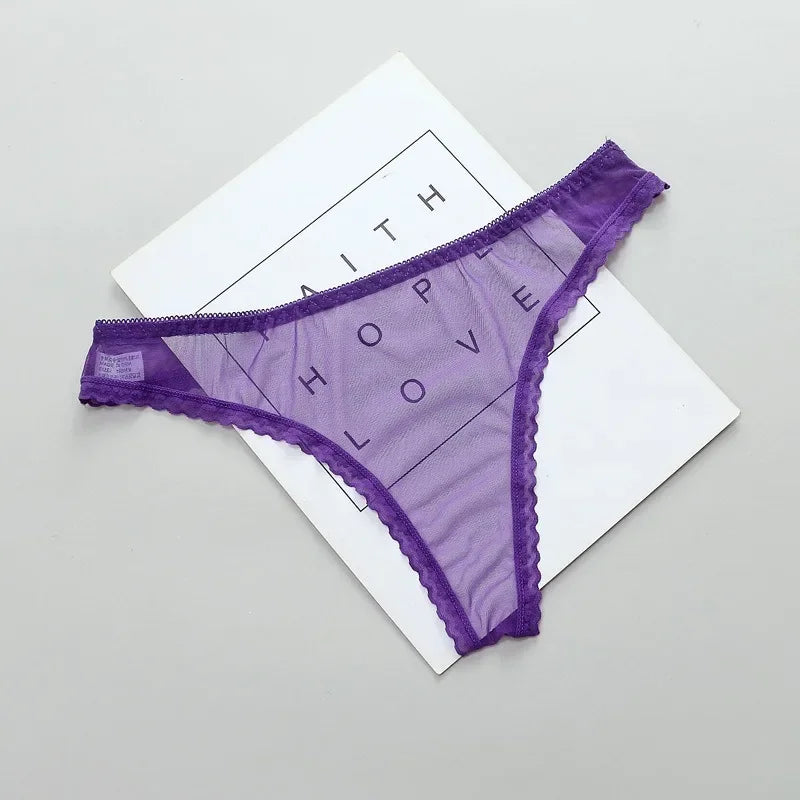 Purple lace underwear on a white card with text on a gray background