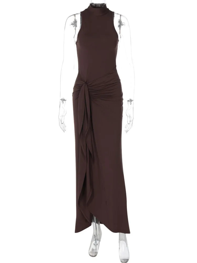 Brown evening gown on a mannequin against a white background