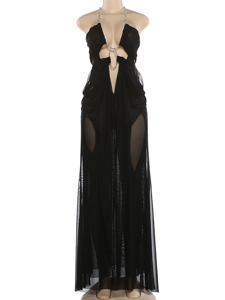 Black evening gown with sheer panels on a white background