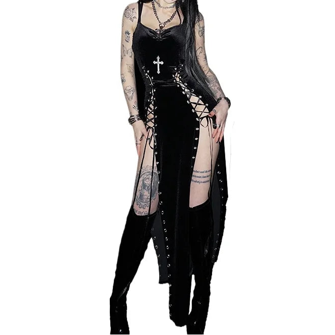 Person wearing a black gothic outfit with tattoos on a white background