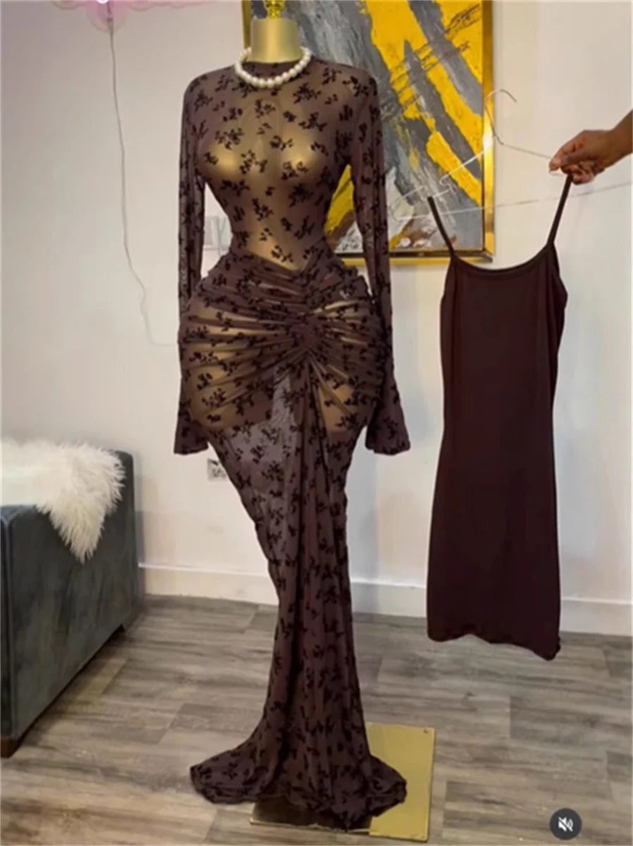 Sheer floral dress on a mannequin with a plain background
