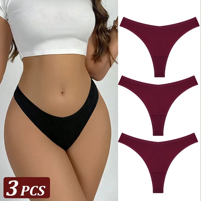 Black thong worn by a person with three additional maroon thongs displayed on a white background.