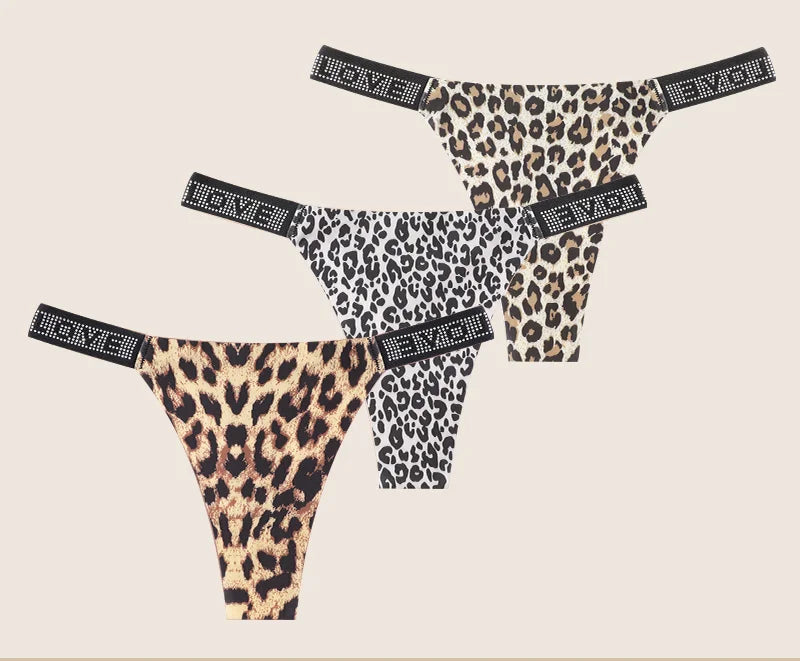Leopard print panties with rhinestone accents on a beige background