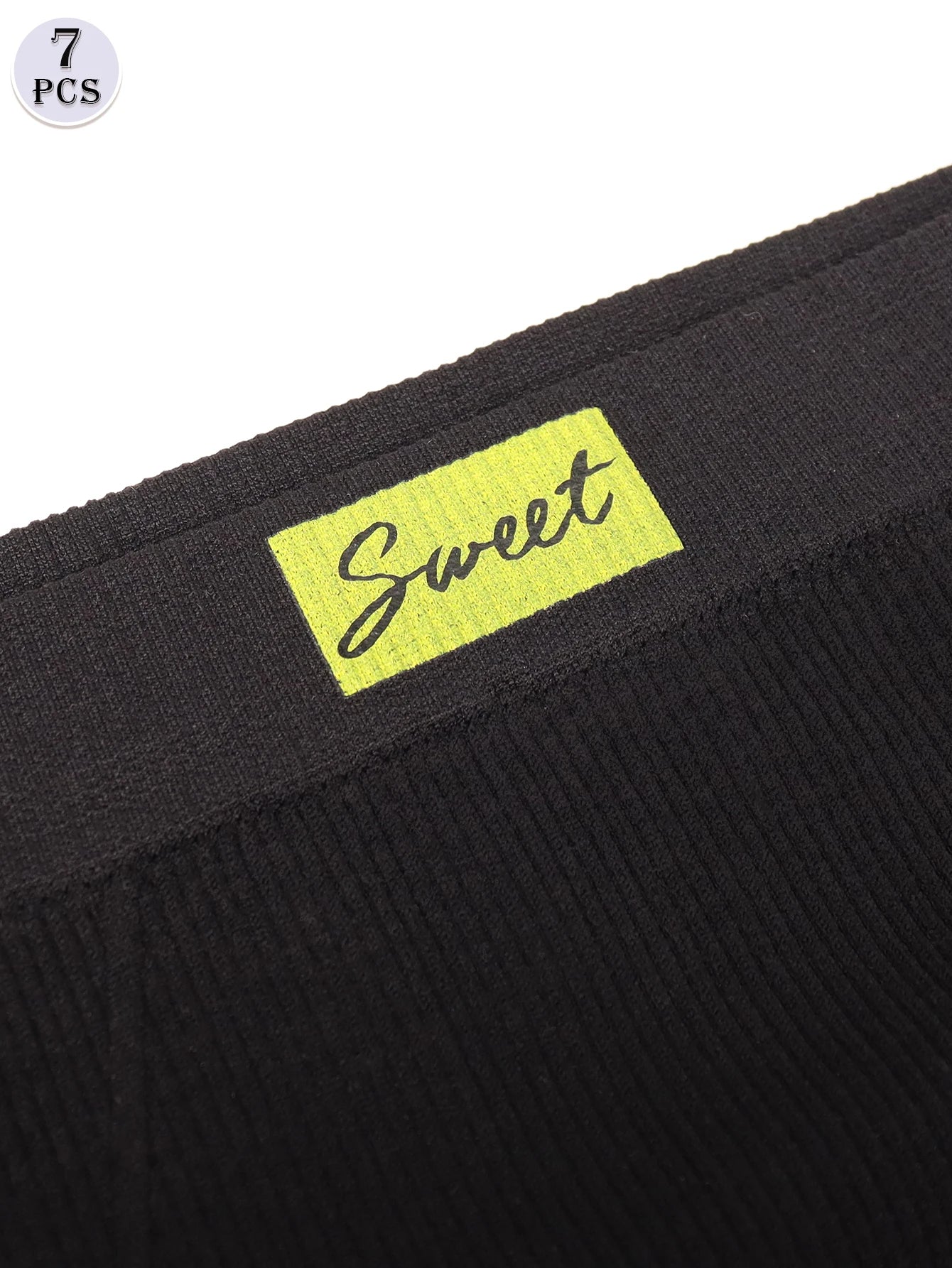 Black fabric with a yellow 'Sweet' label on a white background