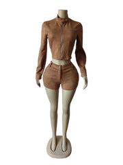 Mannequin wearing a brown leather outfit on a white background