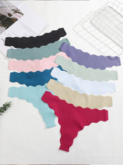 Set of colorful scalloped headbands on a white surface