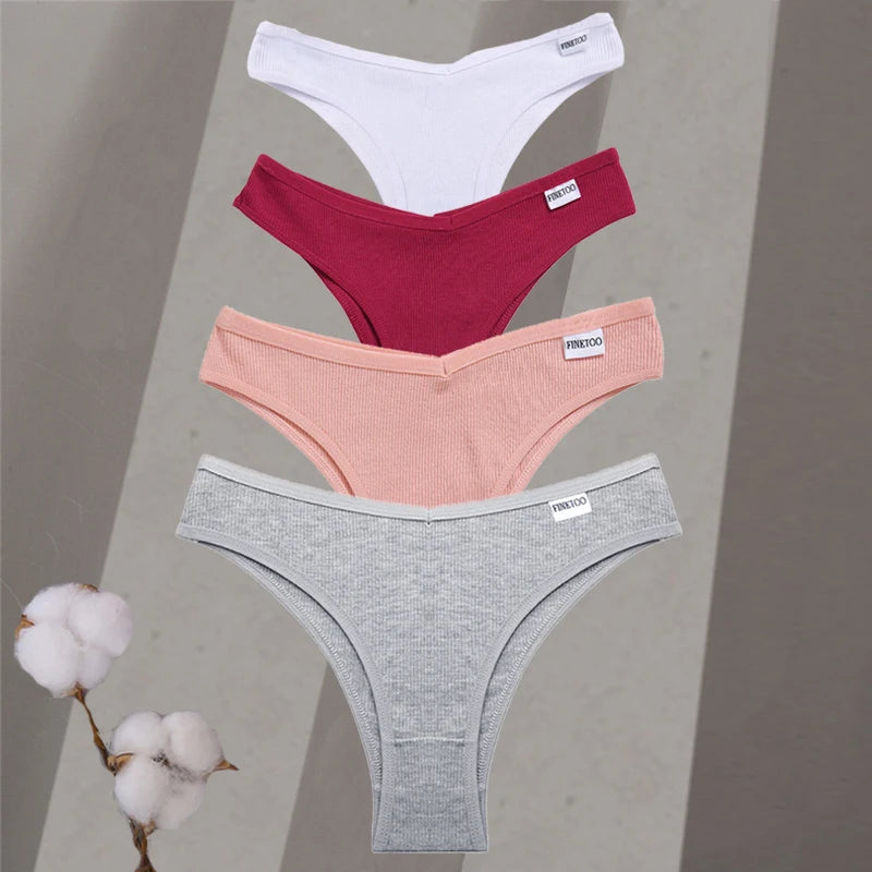 Four pairs of underwear in white, red, pink, and gray on a neutral background with cotton branches.