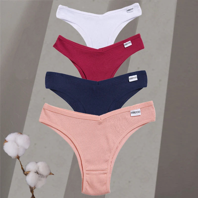 Four pairs of women's underwear in white, red, blue, and pink on a gray background with cotton branches.