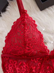 Red lace bra on a white fur surface
