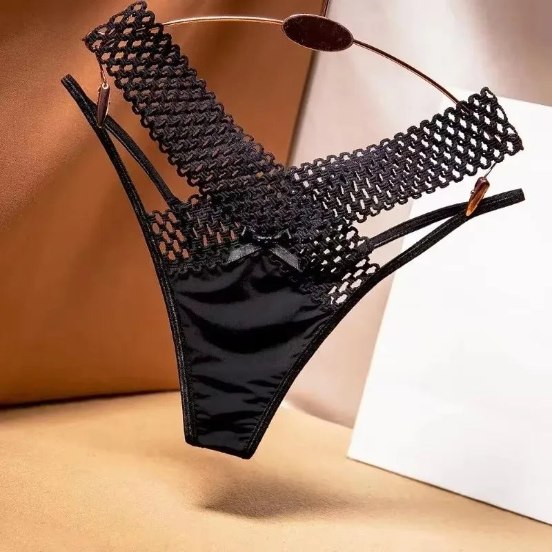 Black lace lingerie set on a neutral background