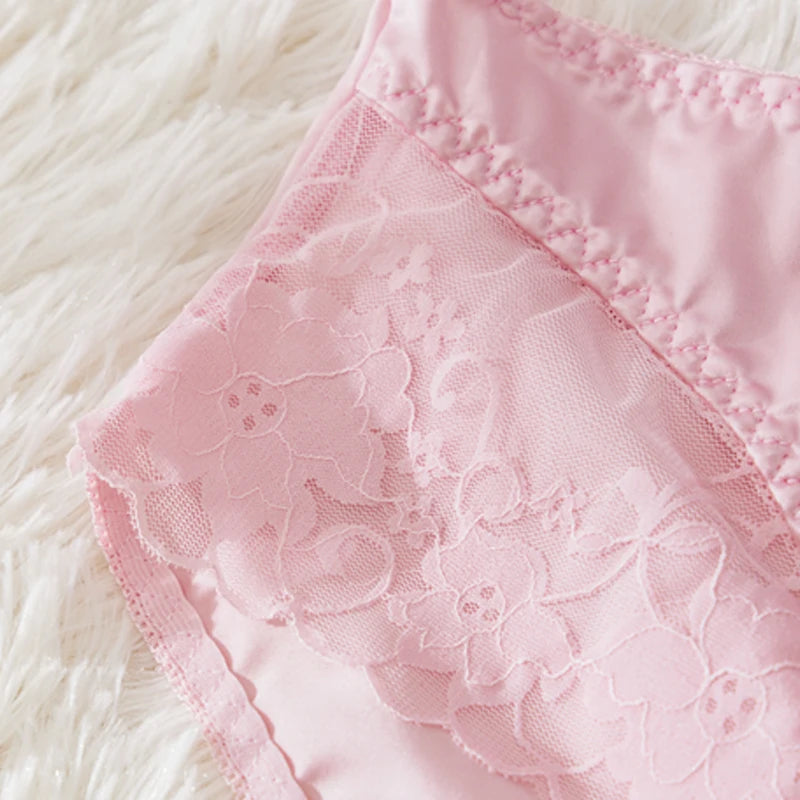 Close-up of pink lace fabric on a white fluffy background