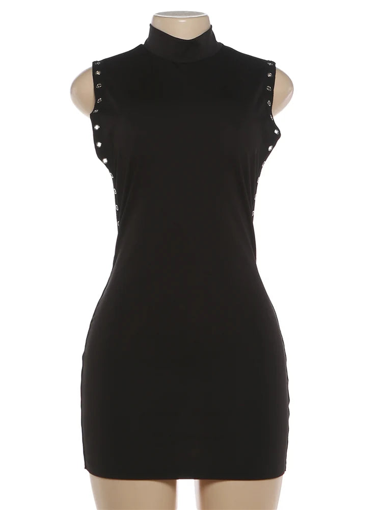 Black dress with studded details on a mannequin against a white background