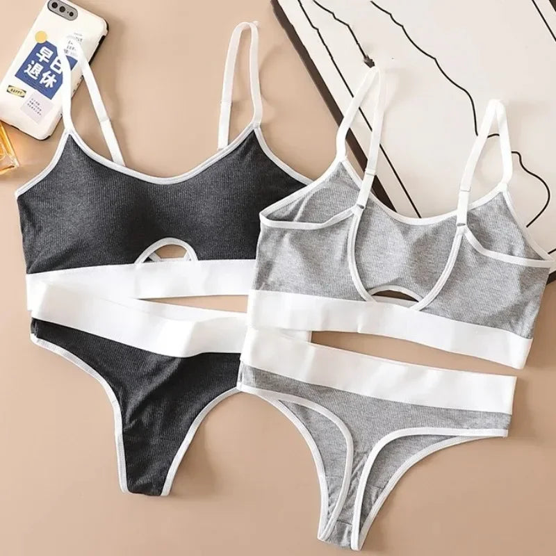 Gray and white bra and panties set on a beige background