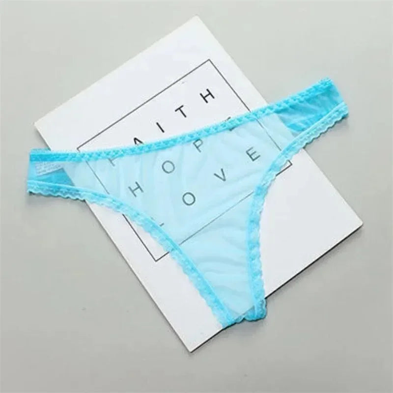 Light blue lace thong on a white card with text on a gray background