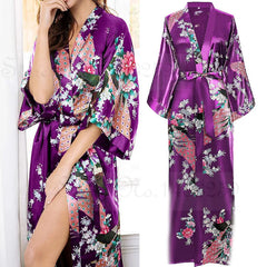 Purple floral satin robe worn by a model with a plain background