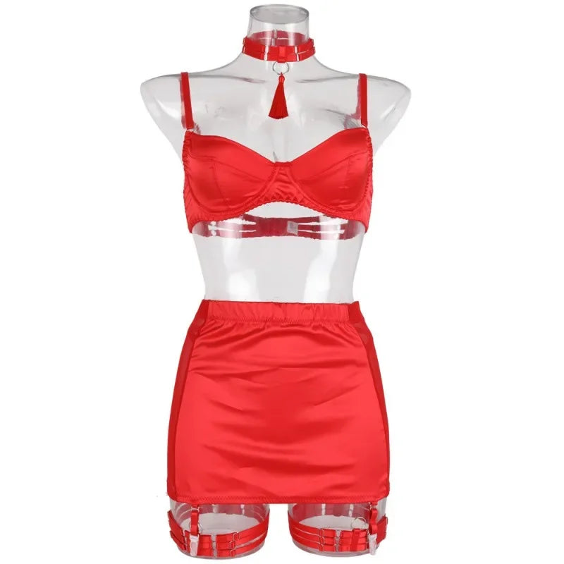 Red lingerie set on a mannequin against a white background