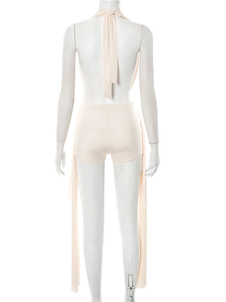 Mannequin wearing a beige sleeveless top with a bow detail on a white background