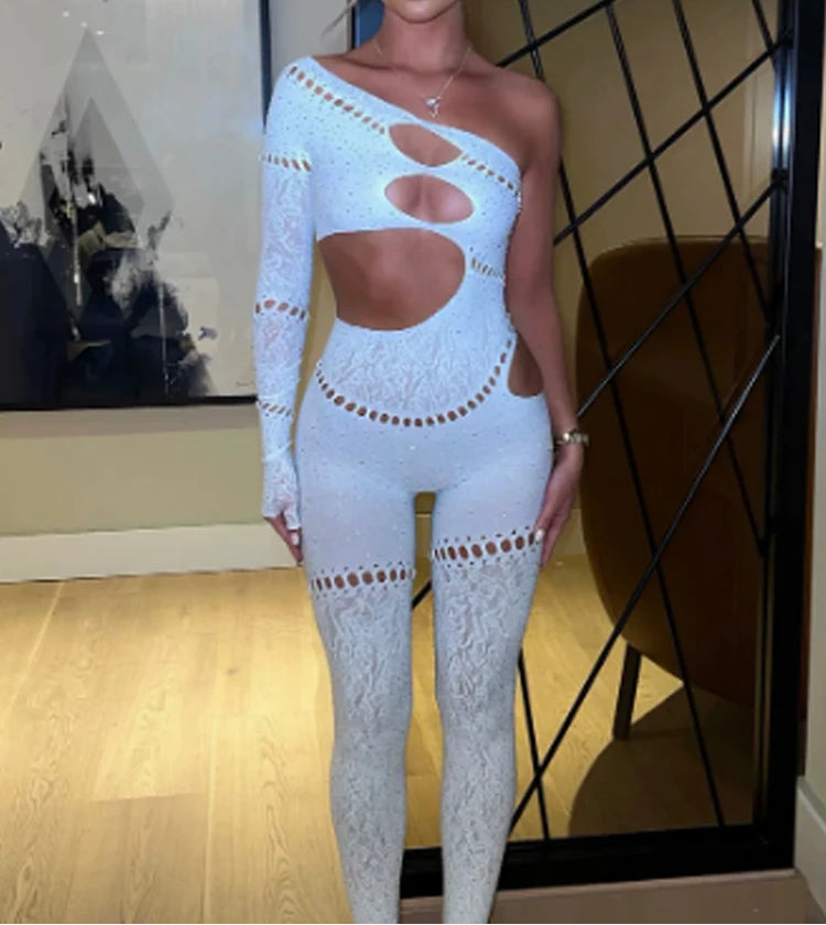 Woman wearing a light blue cut-out bodysuit in an indoor setting.