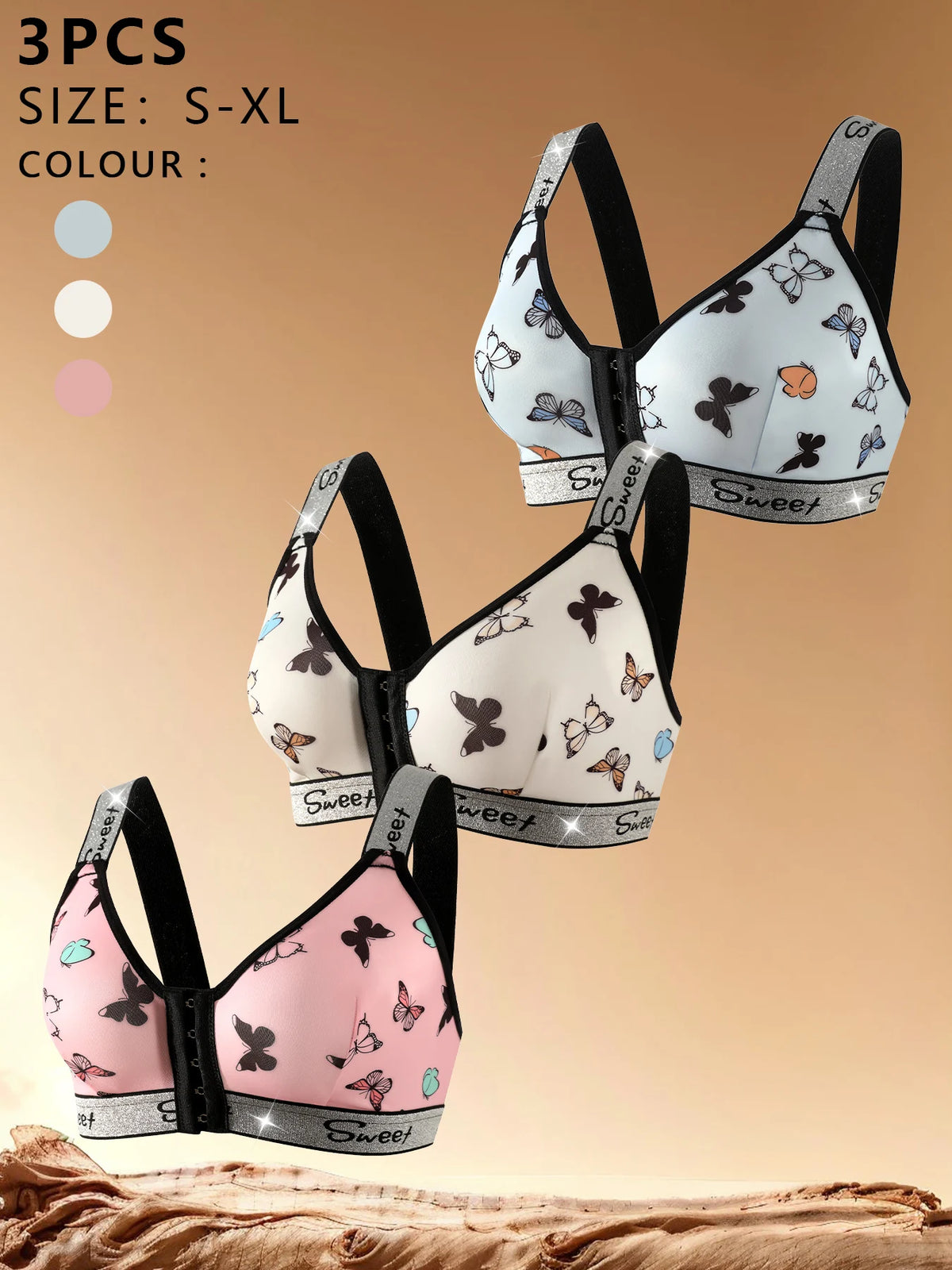Set of three patterned bras on a beige background