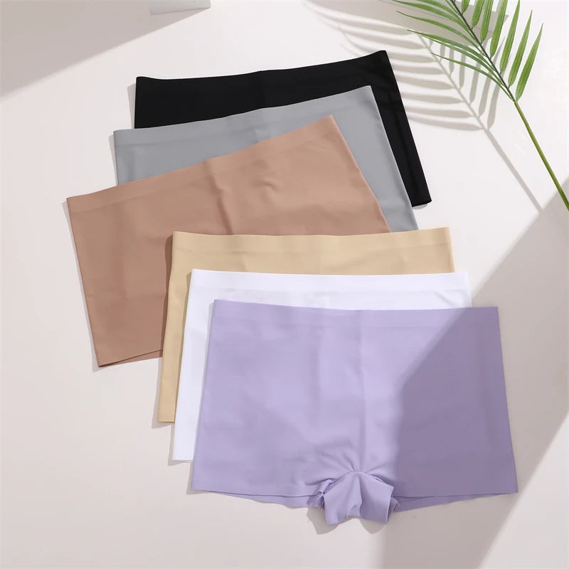 Set of women's underwear in various colors on a light background