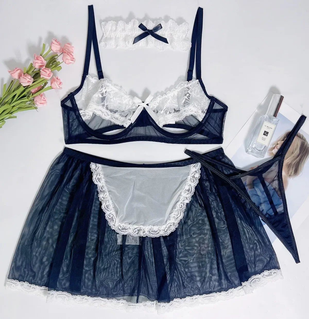 Navy blue lingerie set with lace details on a white background