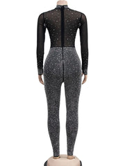 Black bodysuit with silver sequins on a white background