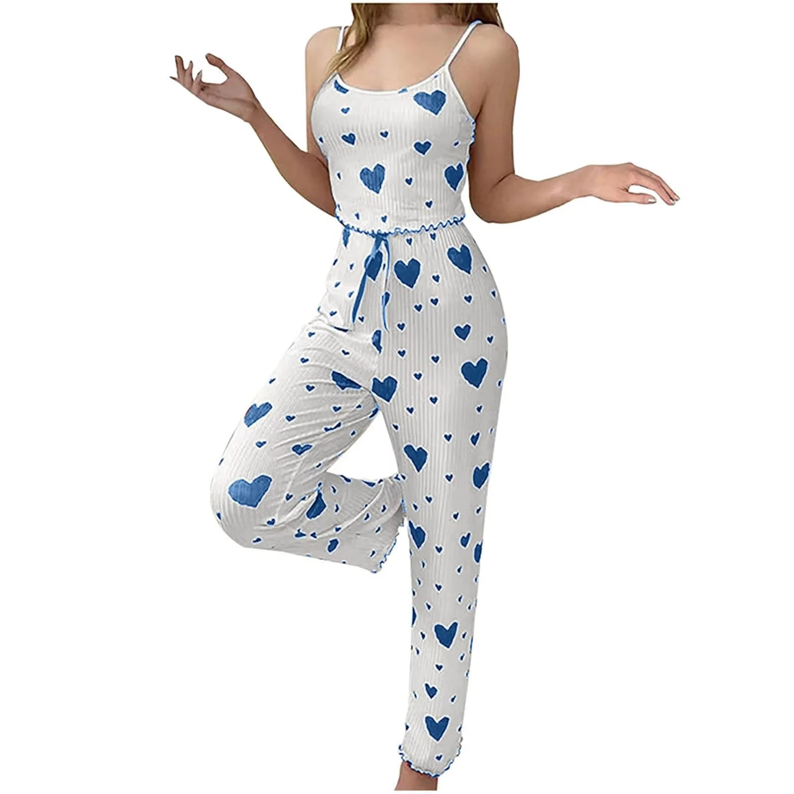 White romper with blue heart patterns on a white background