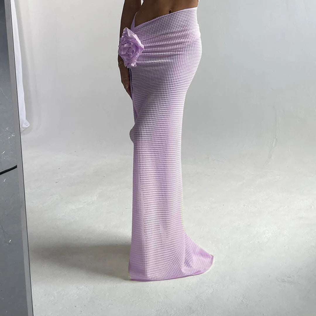 Purple textured dress with a floral detail on a white background