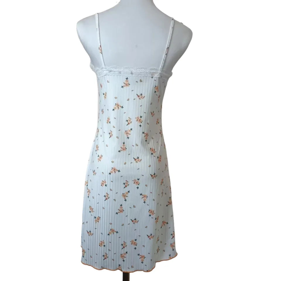 Light blue dress with floral pattern on a mannequin against a white background