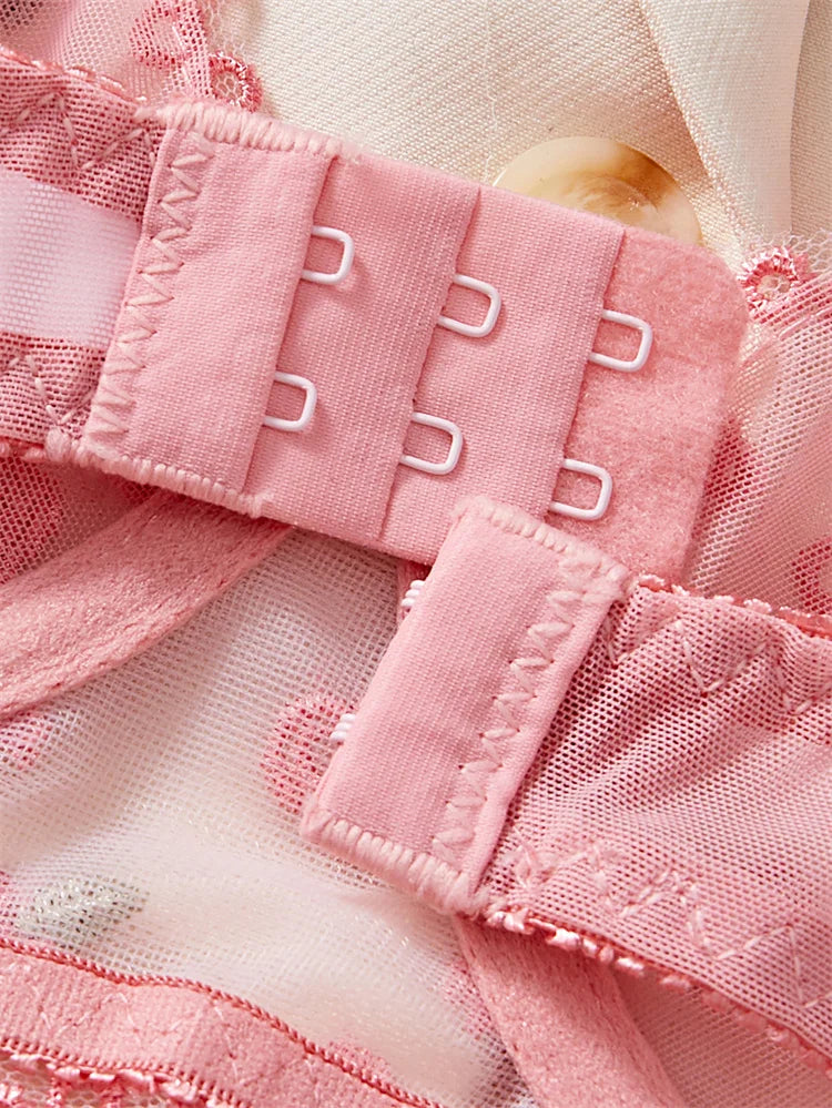 Close-up of pink fabric with metal gussets