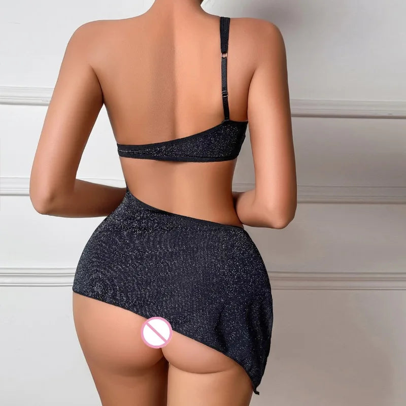 Person wearing a black bikini with a neutral background