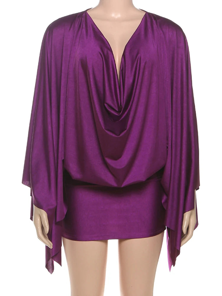 Purple satin top and skirt set on a mannequin against a white background