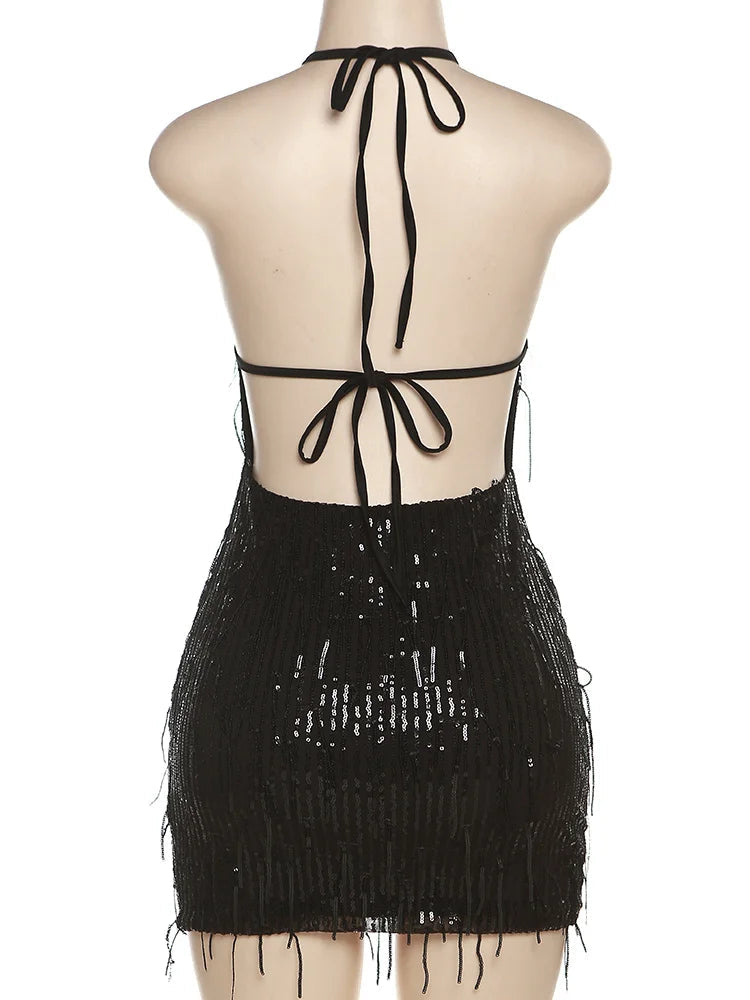 Black fringe dress with halter neck on a mannequin against a white background