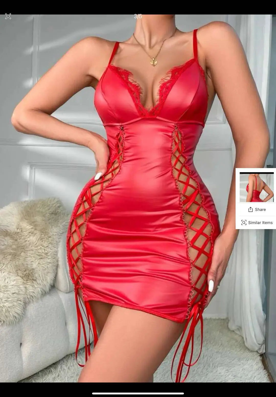 Red satin dress with mesh panels worn by a model indoors.
