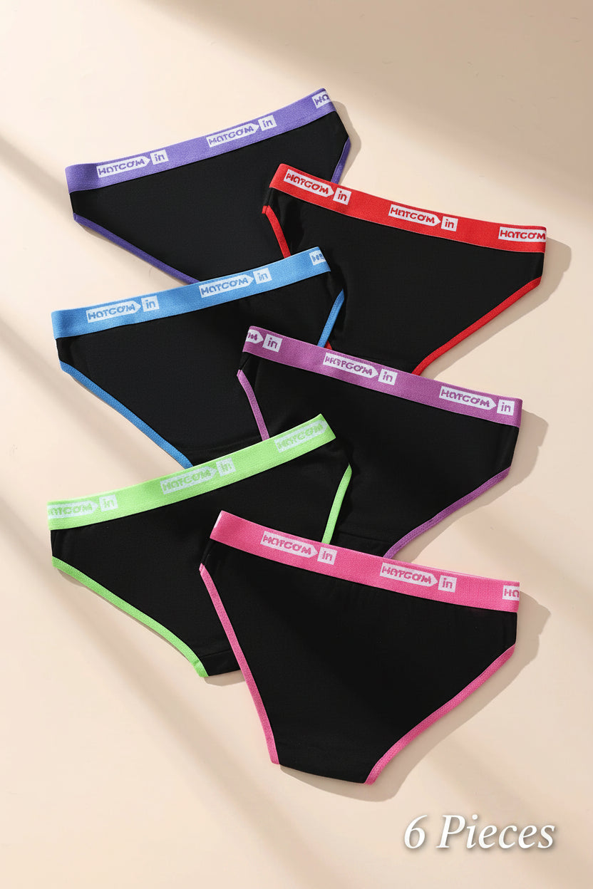 Set of black bikini bottoms with colorful waistbands on a beige background