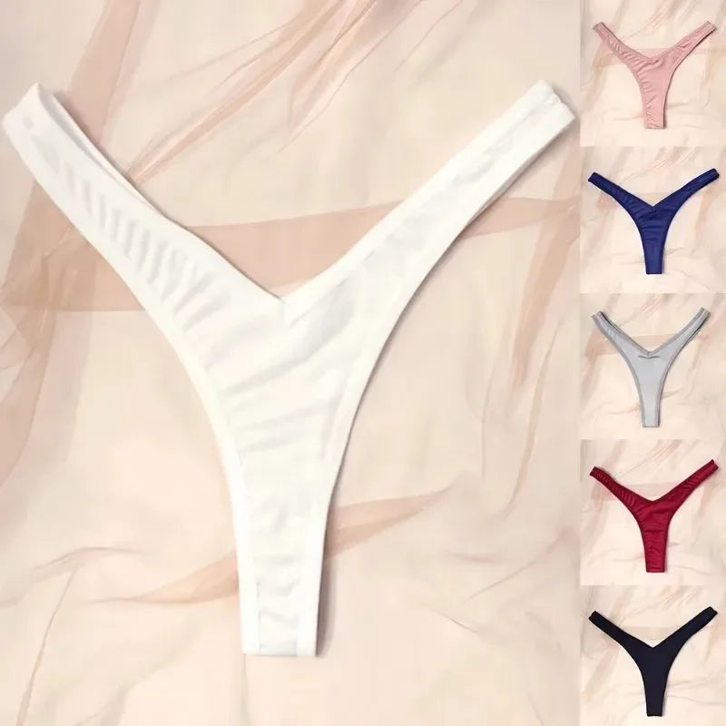 White thong with color options displayed on a beige background