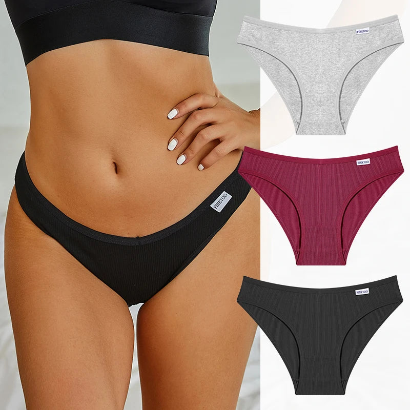 Black underwear worn by a person with additional gray, red, and black underwear displayed.