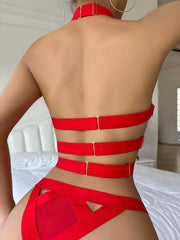 Red bikini set worn by a person in a minimal indoor setting
