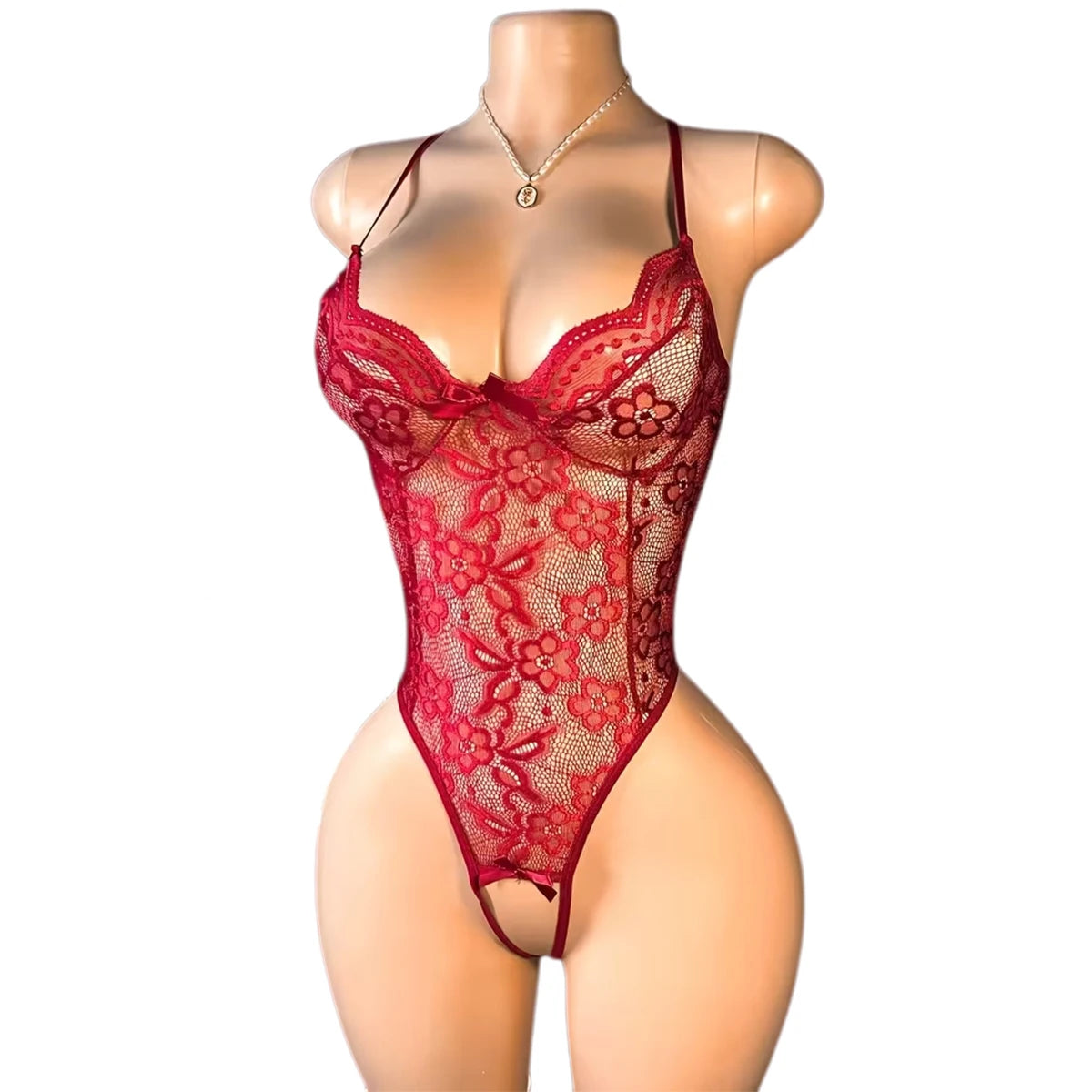Red lace lingerie on a mannequin against a white background