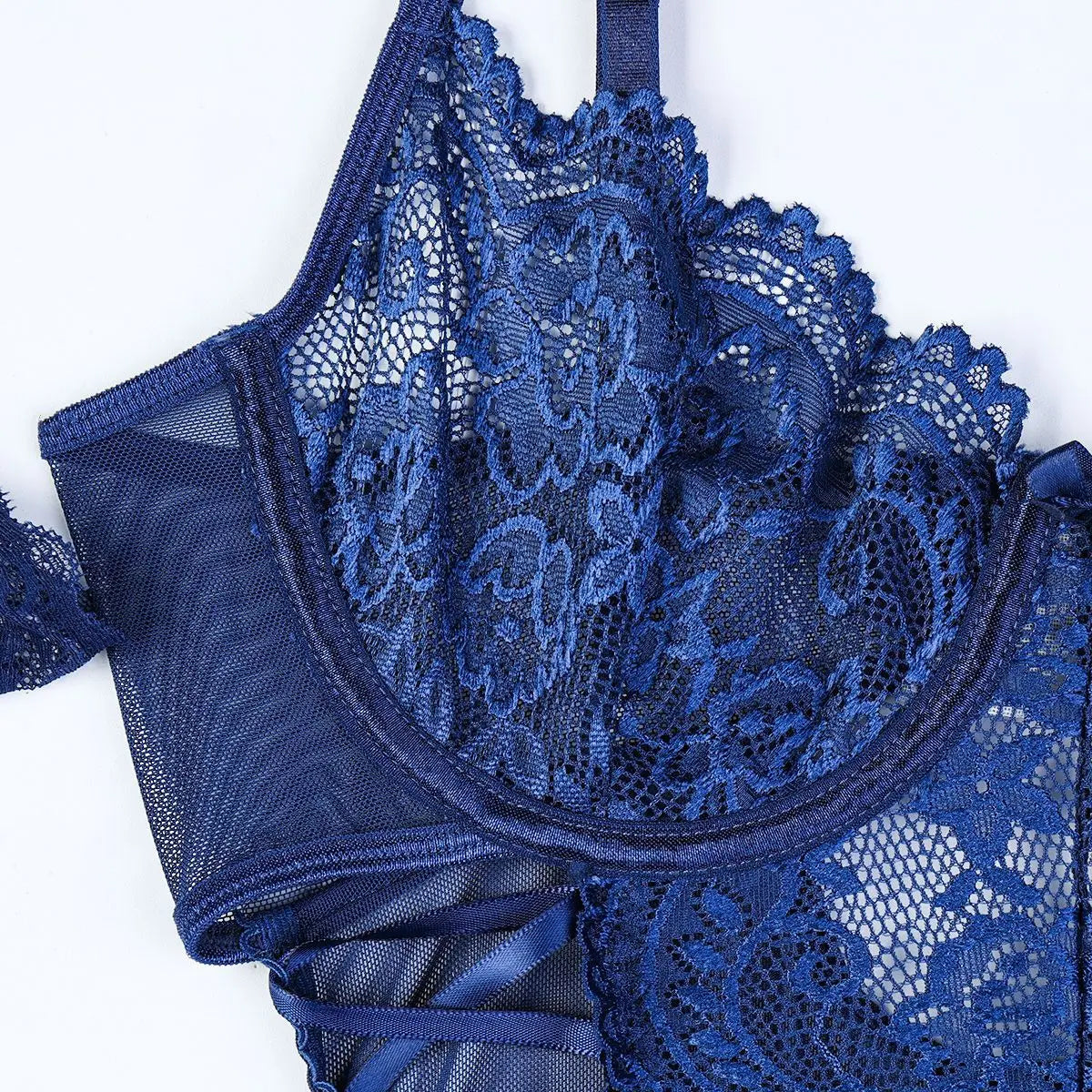 Blue lace lingerie set on a white background