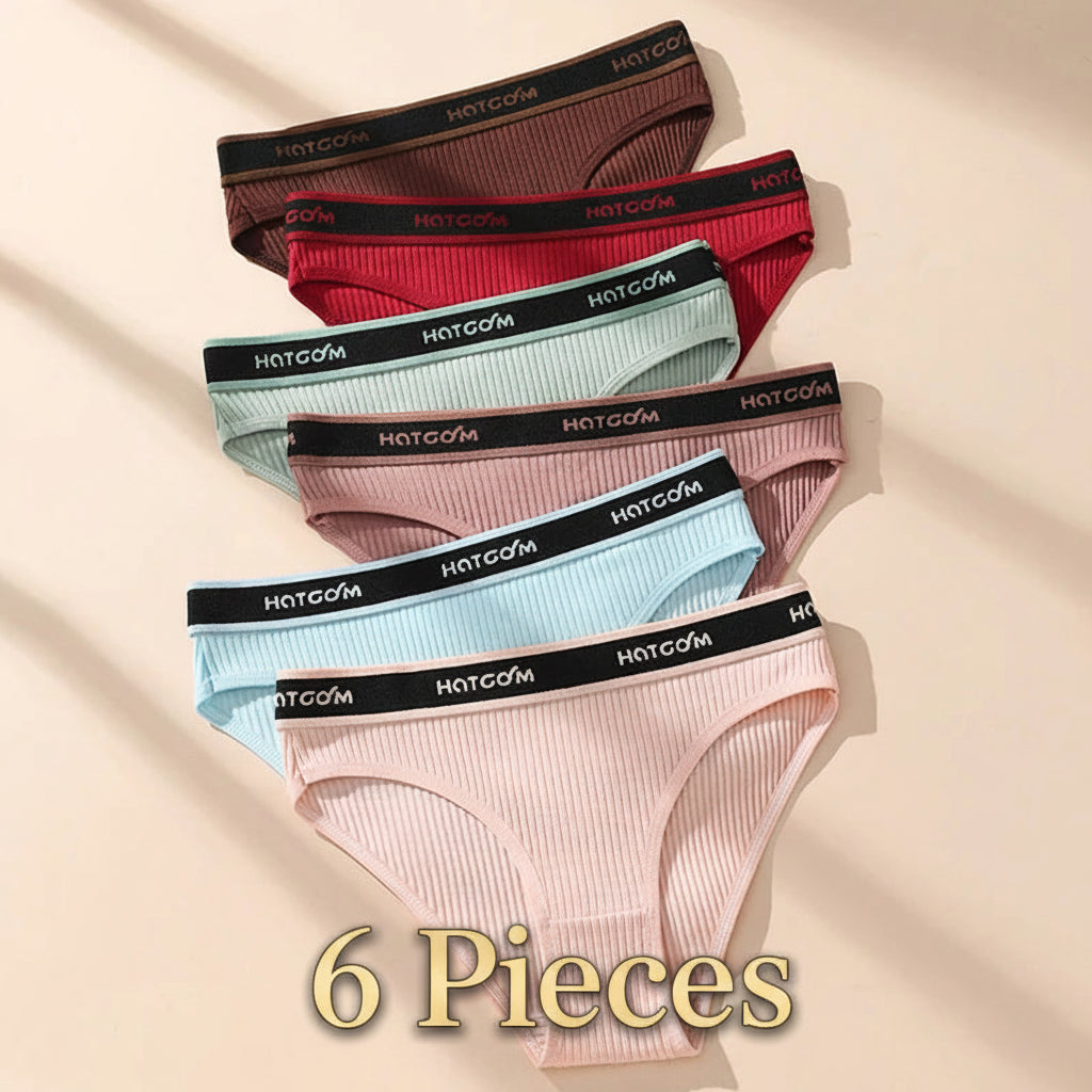 Set of women's underwear with 'HOTCOM' branding on a beige background