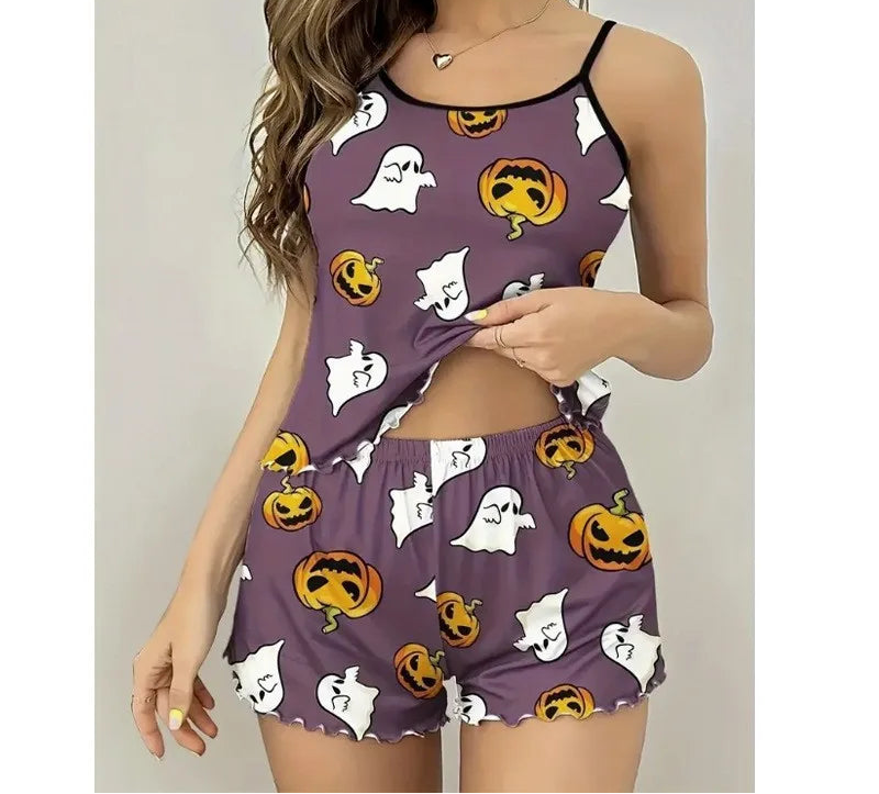 Woman wearing a Halloween-themed pajama set with pumpkins, ghosts, and ghosts on a purple background.