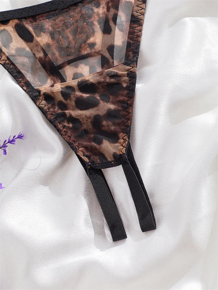 Leopard print garter belt on a white background
