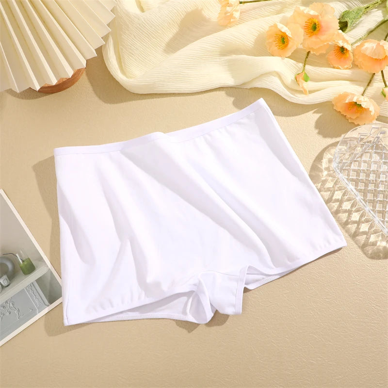 White underwear on a beige surface with decorative elements