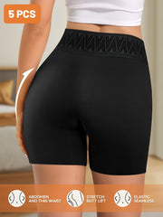 Black athletic shorts worn by a person with text and icons about product features.